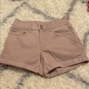 Light pink jean shorts.